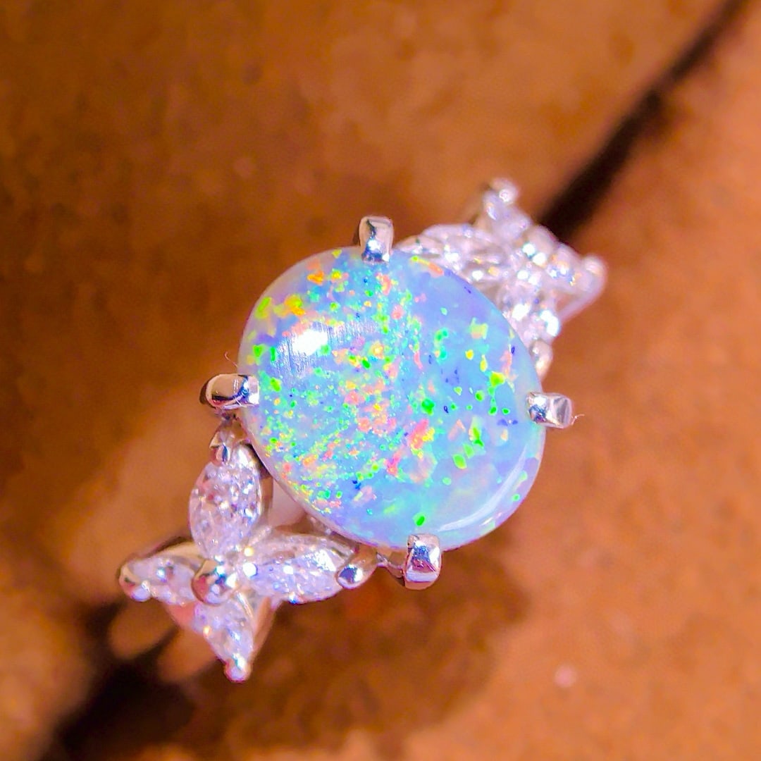 14k Gold 2.45 Ctw Natural Opal & Diamond Ring: Ref:231043252 // gold content:14k gold // ring size:7. 25us // // main gemstone:opal // shape:oval // carat weight:2ct // color:color // treatment:natural // // adjacent gemstone 2 : diamond //