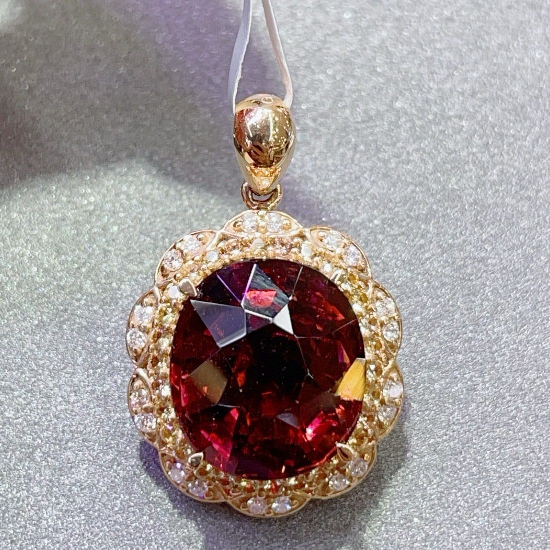 14k Gold 8.32 Ct Natural Tourmaline & Diamond Pendant( Without Chain ): Ref:231043258 // gold content:14k gold // main gemstone:tourmaline // shape:oval // carat weight:8. 32ct // color:red // treatment:natural // // adjacent gemstone 2 : diamond // number of stones:50
