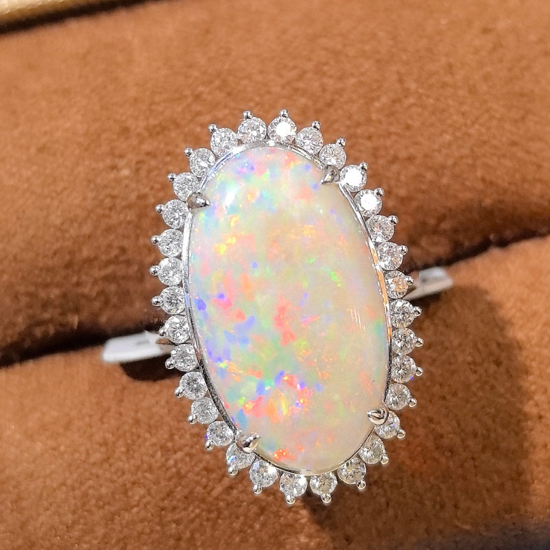 14k Gold 6.36 Ctw Natural Opal & Diamond Ring: Ref:231044037 // gold content:14k gold // ring size:7. 25us // // main gemstone:opal // shape:oval // carat weight:5. 65ct // color:white // treatment:natural // // adjacent gemstone 2 : diamond // sh