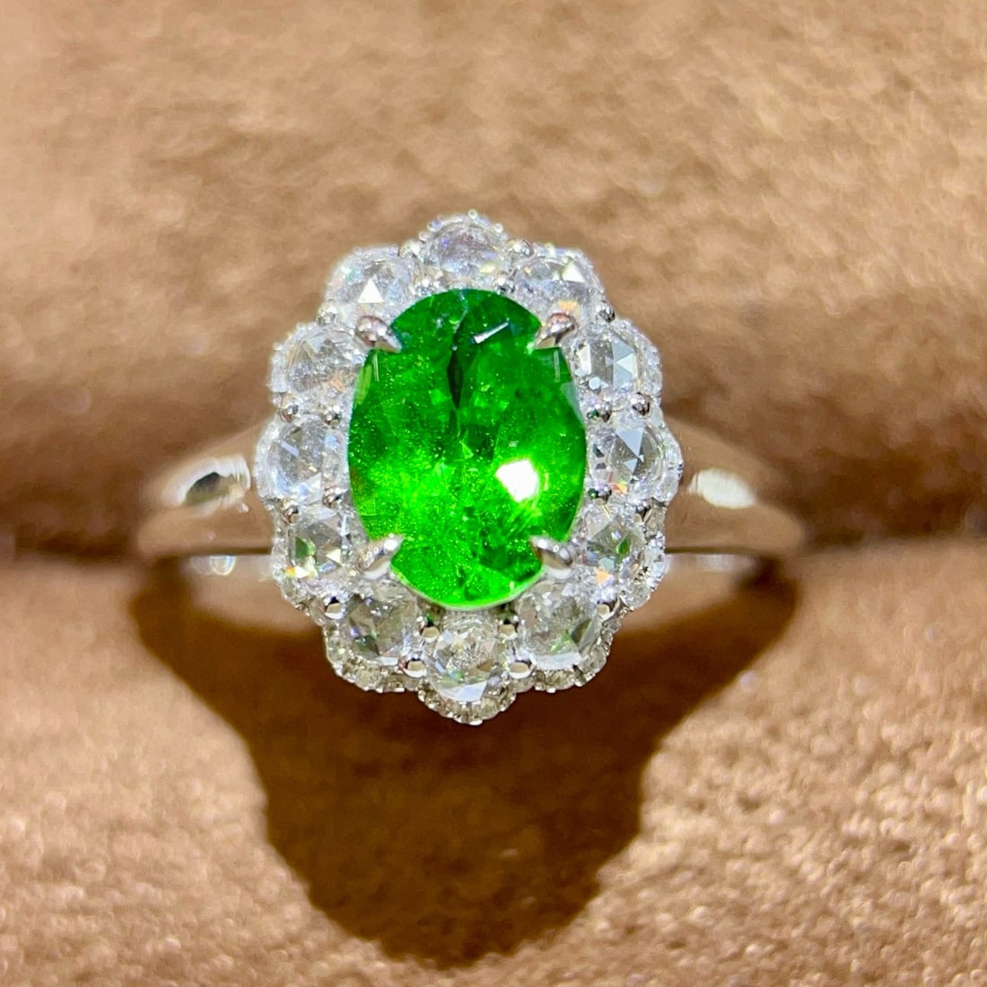 14k Gold 1.73 Ctw Vivid Green Natural Tsavorite & Diamond Ring: Ref:231044079 // gold content:14k gold // ring size:7. 25us // // main gemstone:tsavorite // shape:oval // carat weight:1. 25ct // color:vivid green // treatment:natural // // adjacent gemstone 2 :