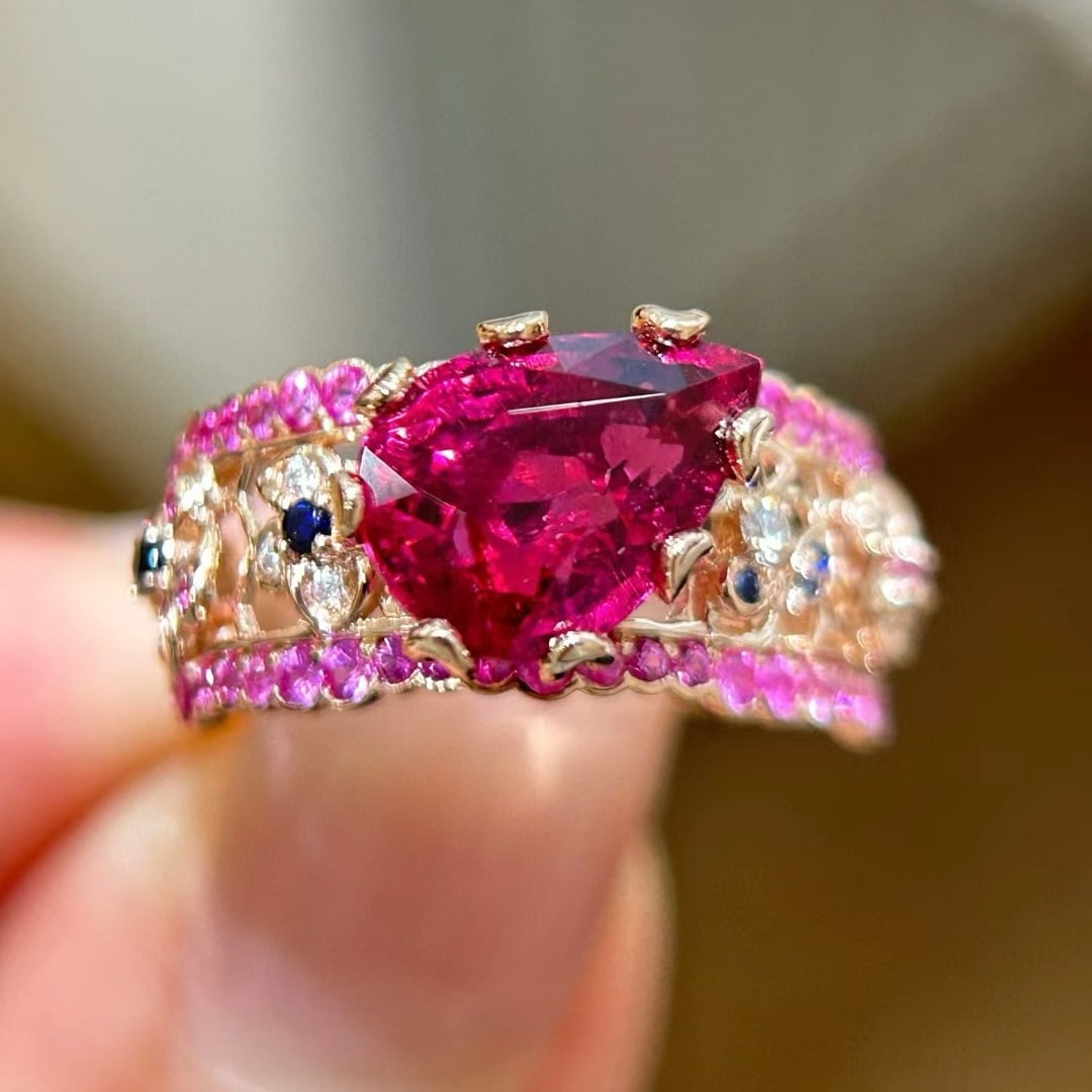 14k Gold 3.9 Ctw Natural Tourmaline & Sapphire Ring: Ref:231044380 // gold content:14k gold // ring size:7. 25us // // main gemstone:tourmaline // shape:pear // carat weight:3. 2ct // color:red // treatment:natural // // adjacent gemstone 2 : sapphire