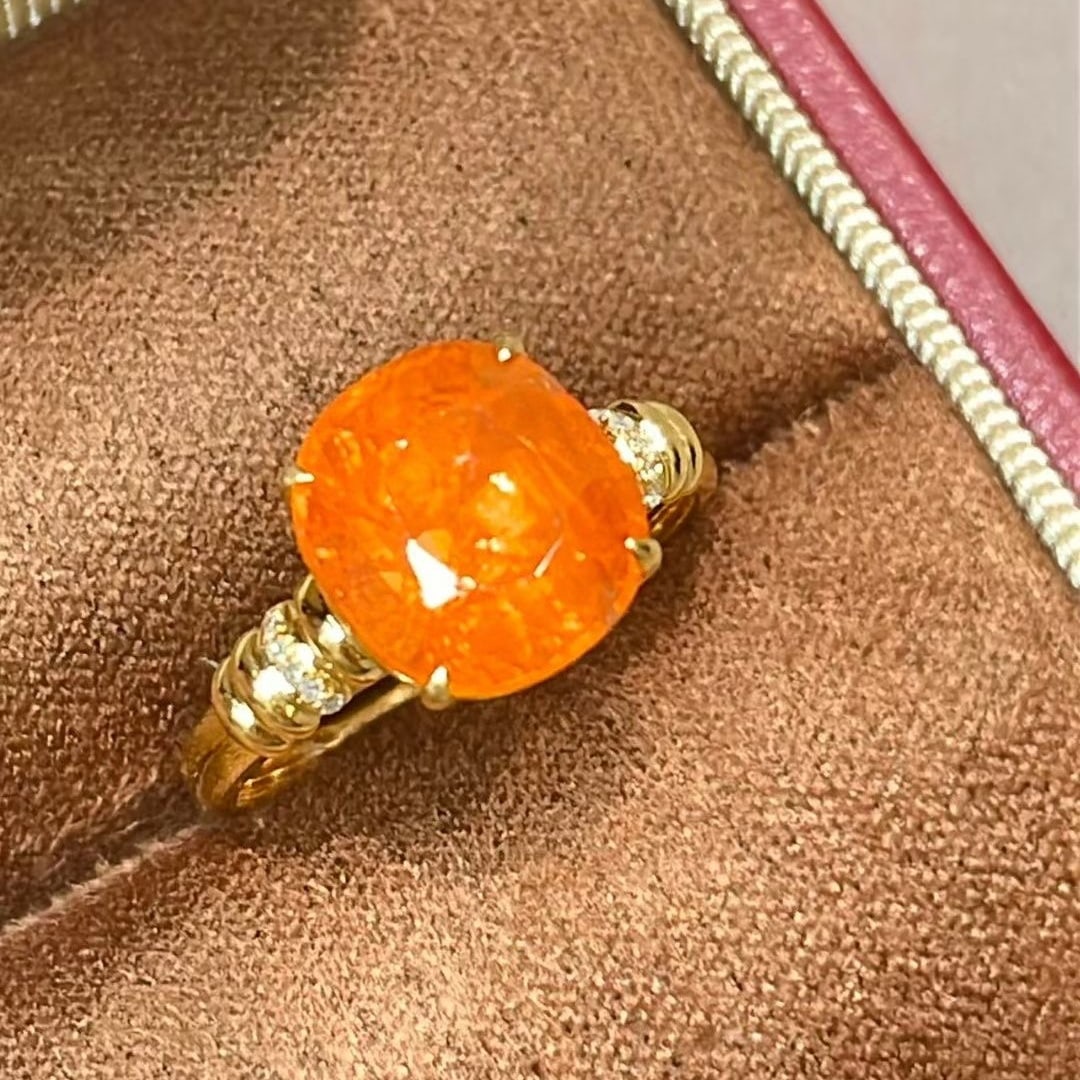 14k Gold 5.6 Ct Natural Spessartine & Diamond Ring: Ref:231044387 // gold content:14k gold // ring size:7. 25us // // main gemstone:spessartine // shape:oval // carat weight:5. 6ct // color:orange // treatment:natural // // adjacent gemstone 2 :