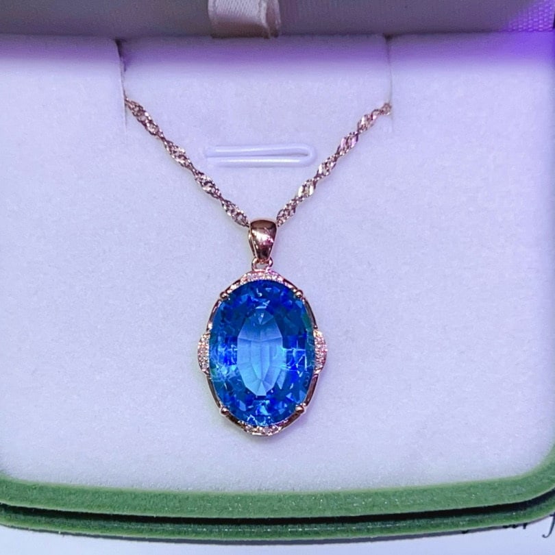 14k Gold 10.80 Ctw Natural Topaz & Diamond Pendant( Without Chain ): Ref:231044391 // gold content:14k gold // main gemstone:topaz // shape:oval // carat weight:10. 75ct // color:blue // treatment:natural // // adjacent gemstone 2 : diamond // number of stones:16 //