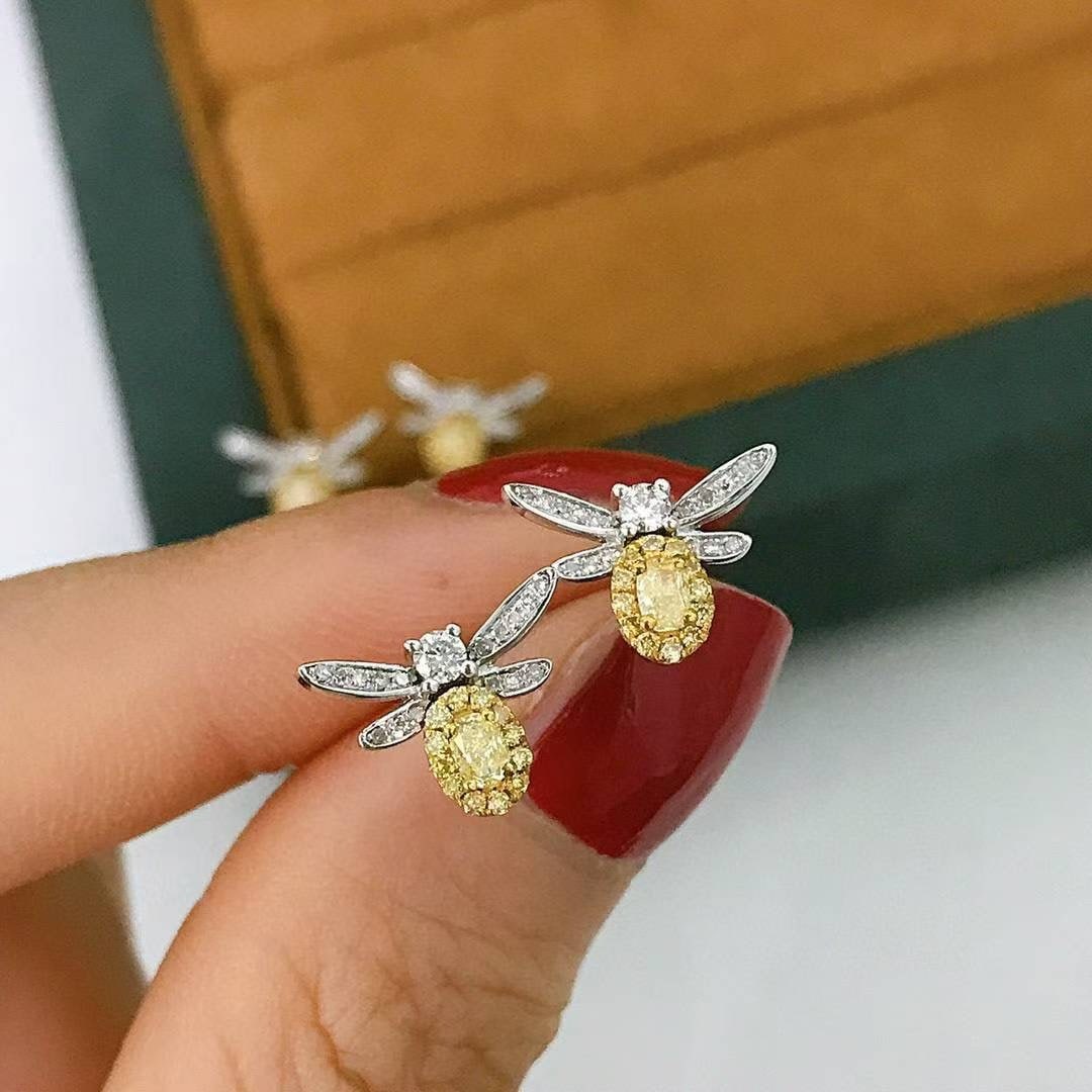 14k Gold 0.45 Ct Natural Color Diamond Earrings: Ref:231044432 // gold content:14k gold // main gemstone:diamond // shape:multiply // carat weight:0. 45ct // clarity grade:vs-si // color:color // treatment:natural // Condition: New Low Estimate: