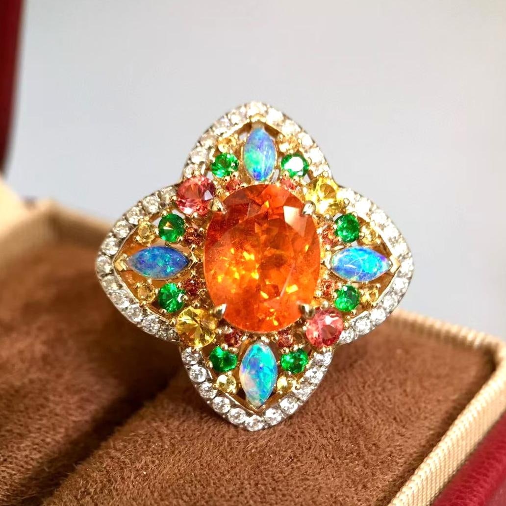 14k Gold 6.01 Ctw Natural Spessartine & Diamond Ring: Ref:231045013 // gold content:14k gold // ring size:7. 25us // // main gemstone:spessartine // shape:oval // carat weight:5. 35ct // color:orange // treatment:natural // // adjacent gemstone 2 : diamo