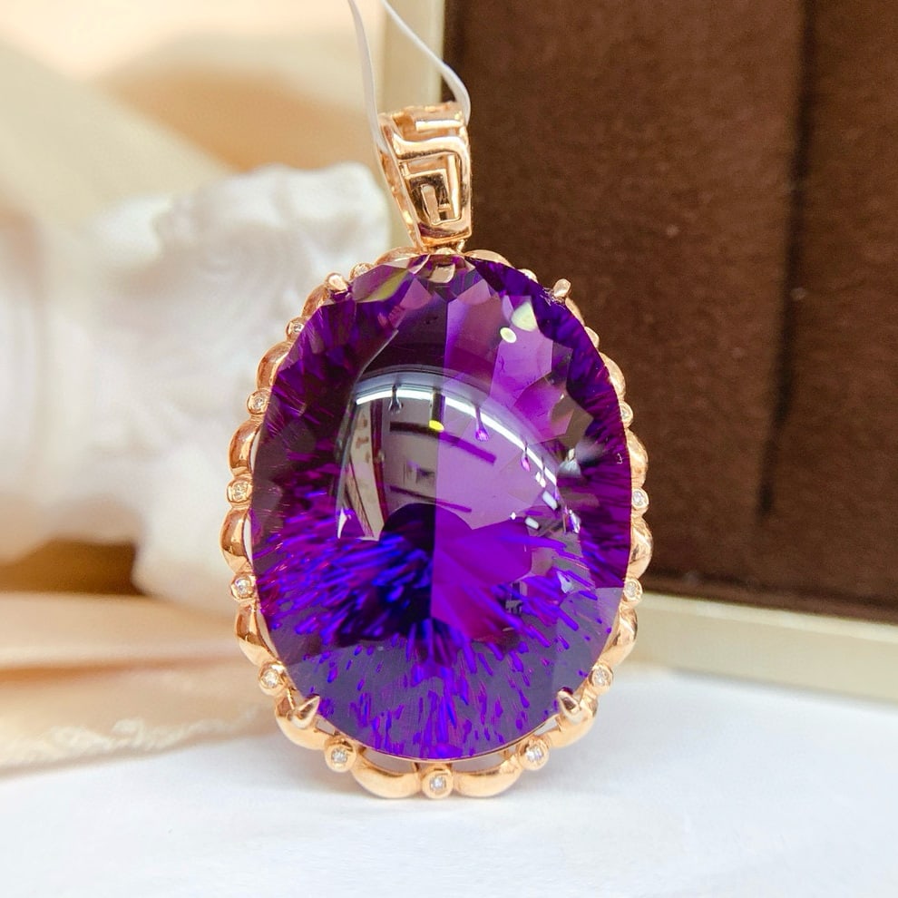 14k Gold 44.65 Ct Natural Amethyst & Diamond Pendant( Without Chain ): Ref:231045019 // gold content:14k gold // main gemstone:amethyst // shape:oval // carat weight:44. 65ct // color:purple // treatment:natural // // adjacent gemstone 2 : diamond // number of stones:16