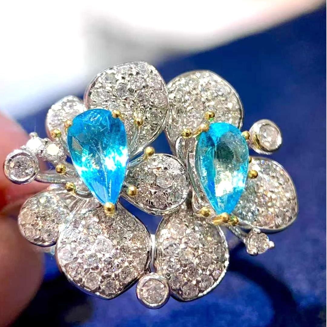 14k Gold 0.78 Ct Natural Paraiba Tourmaline & Diamond Ring: Ref:231045049 // gold content:14k gold // ring size:7. 25us // // main gemstone:paraiba tourmaline // shape:pear // carat weight:0. 78ct // color:blue // treatment:natural // // adjacent gemstone 2 :