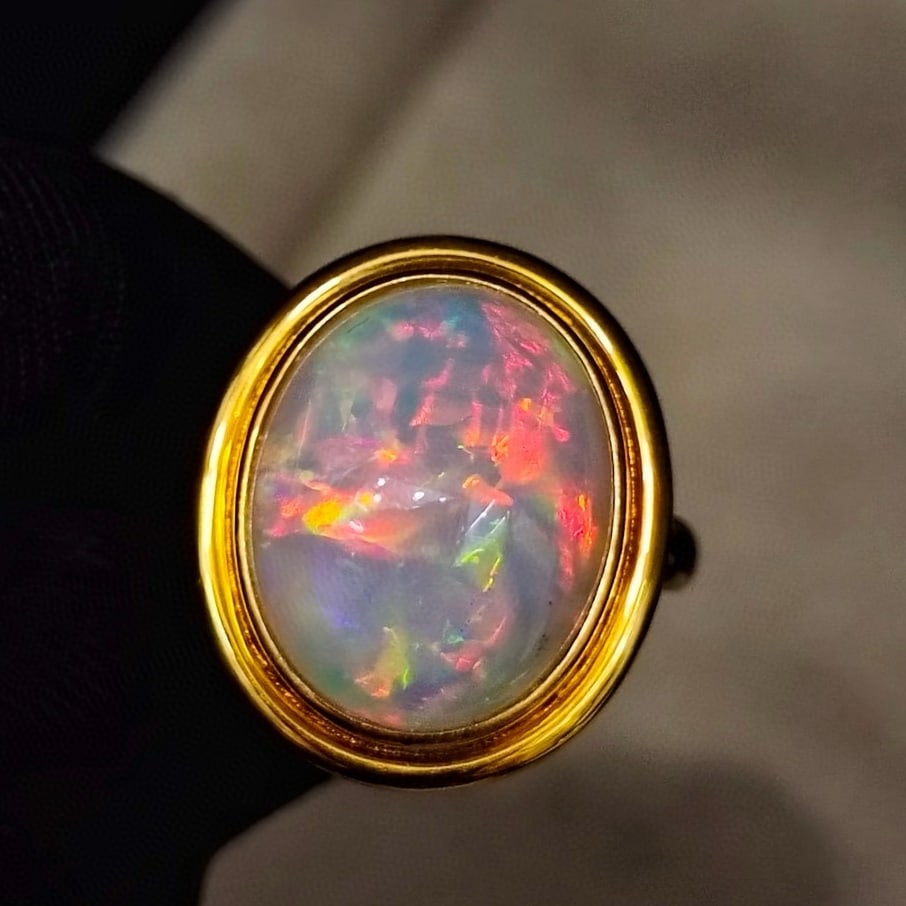 14k Gold 6.55 Ct Natural Opal Ring: Ref:231045121 // gold content:14k gold // ring size:7. 25us // // main gemstone:opal // shape:oval // carat weight:6. 55ct // color:color // treatment:natural // Low Estimate: 3700 Condition: New High