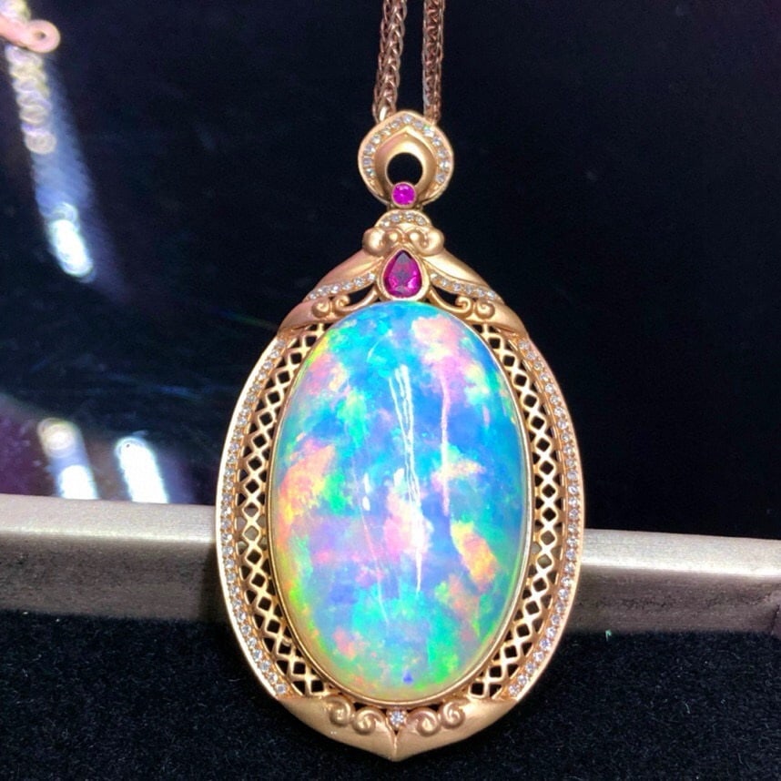 14k Gold 40.6 Ct Natural Opal & Diamond Pendant( Without Chain ): Ref:231046055 // gold content:14k gold // main gemstone:opal // shape:oval // carat weight:40. 6ct // color:color // treatment:natural // // adjacent gemstone 2 : diamond // number of stones:88 // sha