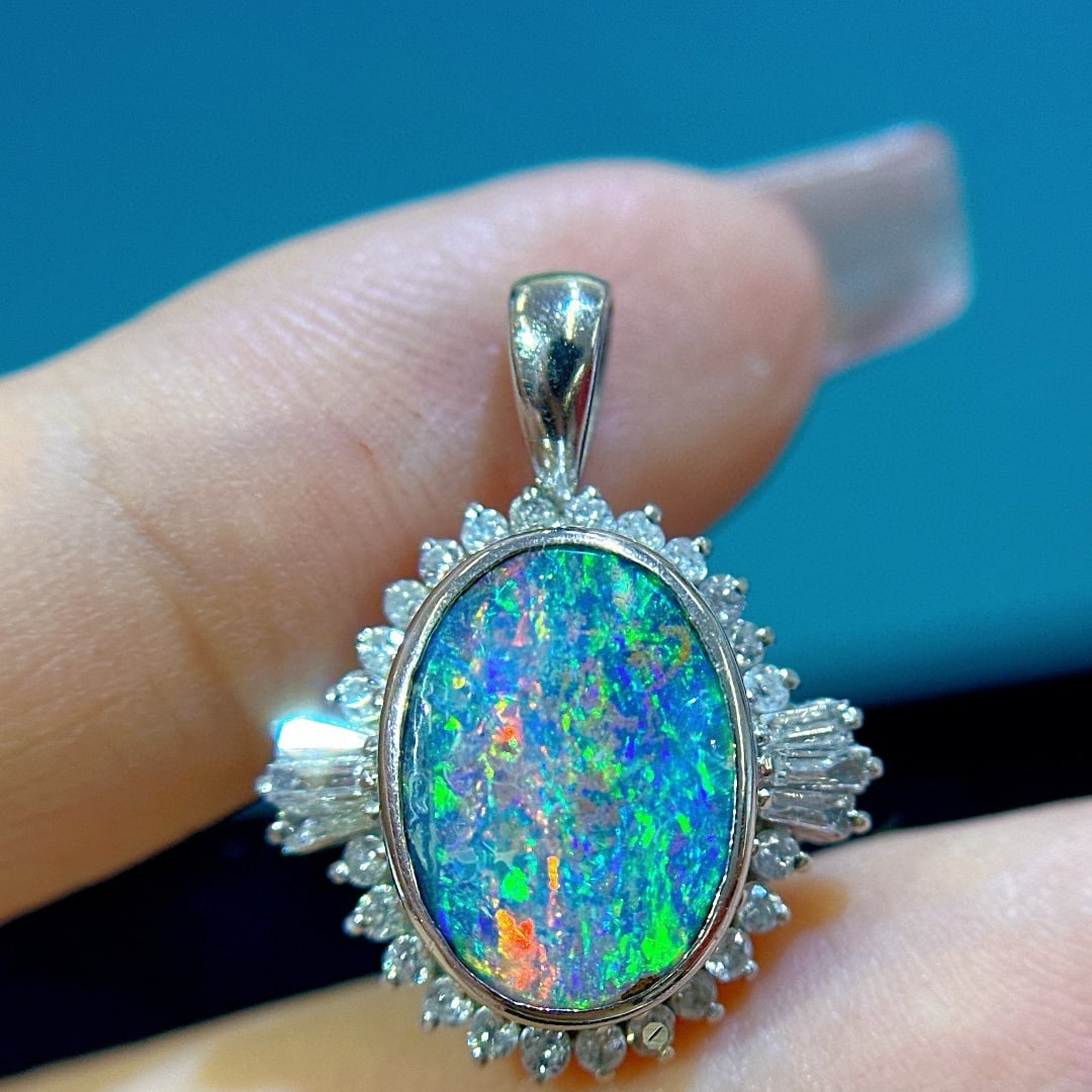 14k Gold 4.3 Ctw Natural Opal & Diamond Pendant( Without Chain ): Ref:231046102 // gold content:14k gold // main gemstone:opal // shape:oval // carat weight:3. 8ct // color:color // treatment:natural // // adjacent gemstone 2 : diamond // shape:multiply // carat wei