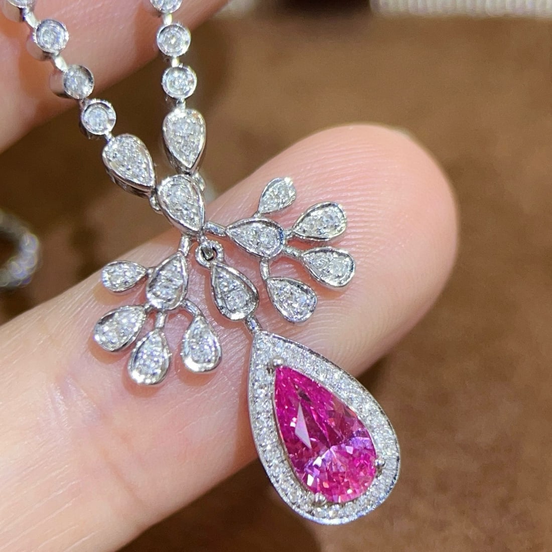 14k Gold 1.43 Ctw Natural Padparadscha Sapphire & Diamond Necklace: Ref:231046159 // gold content:14k gold // main gemstone:padparadscha sapphire // shape:pear // carat weight:1. 0ct // color:orangish pink // treatment:natural // // adjacent gemstone 2 : diamond //