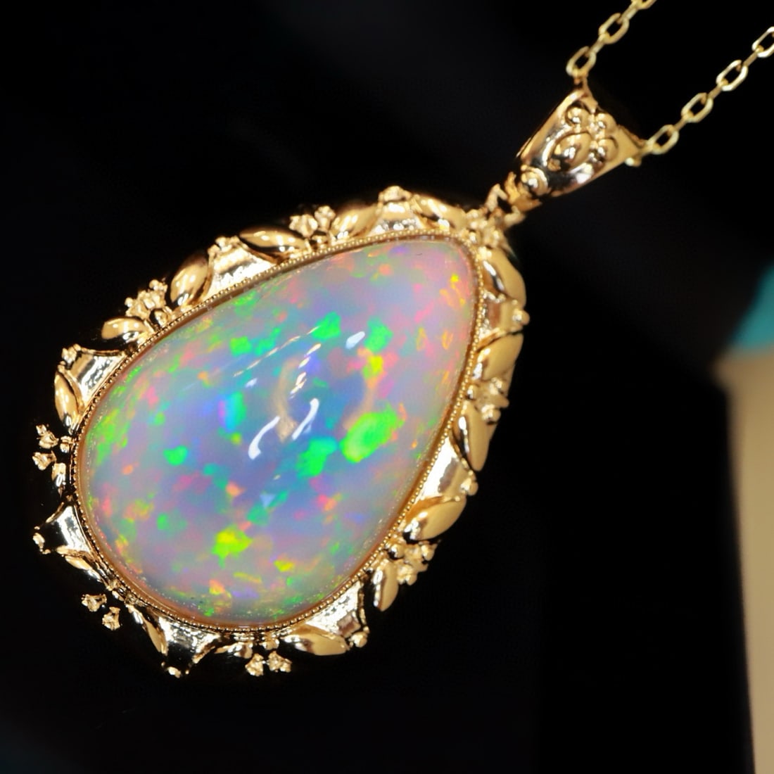 14k Gold 20.46 Ct Natural Opal Pendant( Without Chain ): Ref:231046163 // gold content:14k gold // main gemstone:opal // shape:pear // carat weight:20. 46ct // color:color // treatment:natural // Condition: New Low Estimate: 7900 High Estimate: 12000