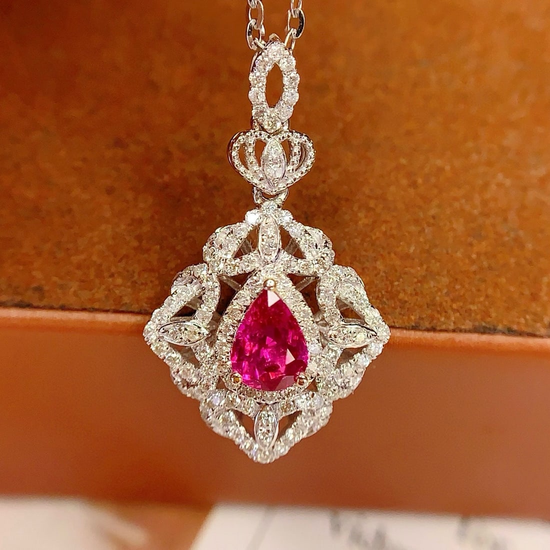 14k Gold 0.8 Ct Natural Ruby & Diamond Pendant( Without Chain ): Ref:231046201 // gold content:14k gold // main gemstone:ruby // shape:pear // carat weight:0. 8ct // color:red // treatment:natural // // adjacent gemstone 2 : diamond // number of stones:106 // shape