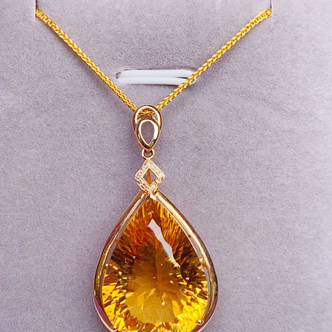 14k Gold 21.23 Ctw Natural Citrine & Diamond Pendant( Without Chain ): Ref:231046358 // gold content:14k gold // main gemstone:citrine // shape:pear // carat weight:21. 2ct // color:yellow // treatment:natural // // adjacent gemstone 2 : diamond // number of stones:12