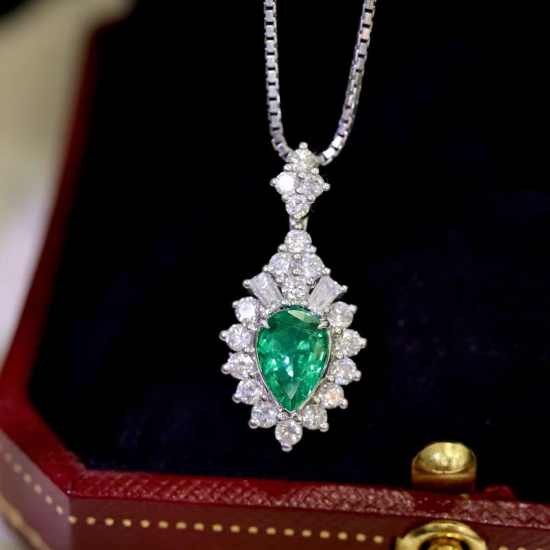 14k Gold 1.68 Ctw Natural Emerald & Diamond Pendant( Without Chain ): Ref:231046419 // gold content:14k gold // main gemstone:emerald // shape:pear // carat weight:0. 93ct // color:green // treatment:natural // // adjacent gemstone 2 : diamond // shape:multiply //