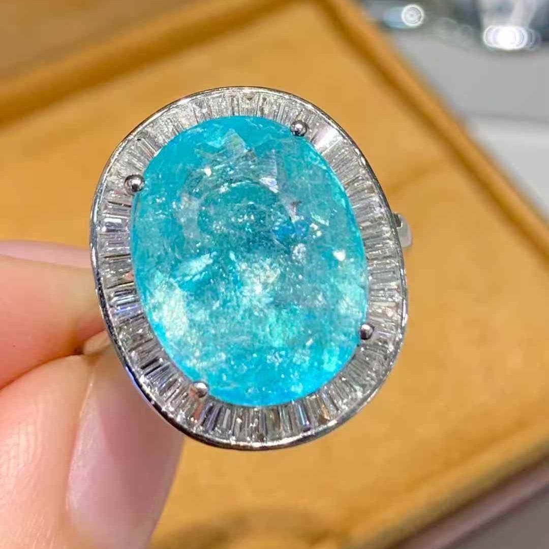 14k Gold 6.6 Ct Natural Paraiba Tourmaline & Diamond Ring: Ref:231047086 // gold content:14k gold // ring size:7. 25us // // main gemstone:paraiba tourmaline // shape:oval // carat weight:6. 6ct // color:blue // treatment:natural // // adjacent gemstone 2 :