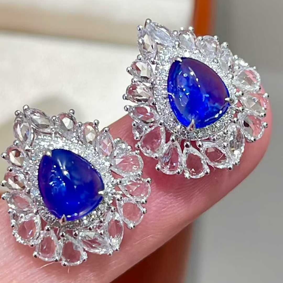 14k Gold 2.1 Ct Natural Sapphire & Diamond & Sapphire Earrings: Ref:231047104 // gold content:14k gold // main gemstone:sapphire // shape:pear // carat weight:2. 1ct // color:royal blue // treatment:natural // // adjacent gemstone 2 : diamond // shape:round //