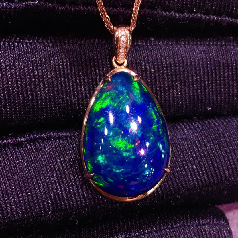 14k Gold 11.22 Ct Natural Opal & Diamond Pendant( Without Chain ): Ref:231048093 // gold content:14k gold // main gemstone:opal // shape:pear // carat weight:11. 22ct // color:color // treatment:natural // // adjacent gemstone 2 : diamond // shape:round // clarity