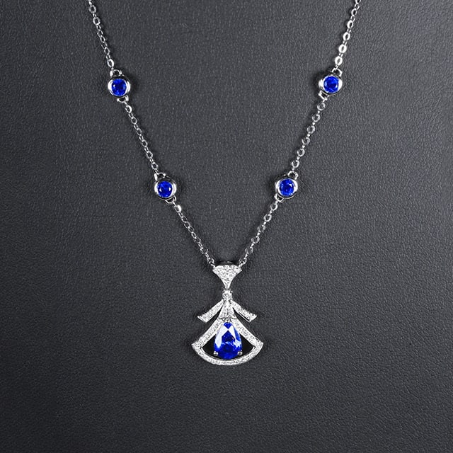 14k Gold 1.65 Ctw Natural Sapphire & Sapphire Necklace: Ref:231048096 // gold content:14k gold // main gemstone:sapphire // shape:pear // carat weight:0. 9ct // color:blue // treatment:natural // // adjacent gemstone 2 : sapphire // shape:round // carat