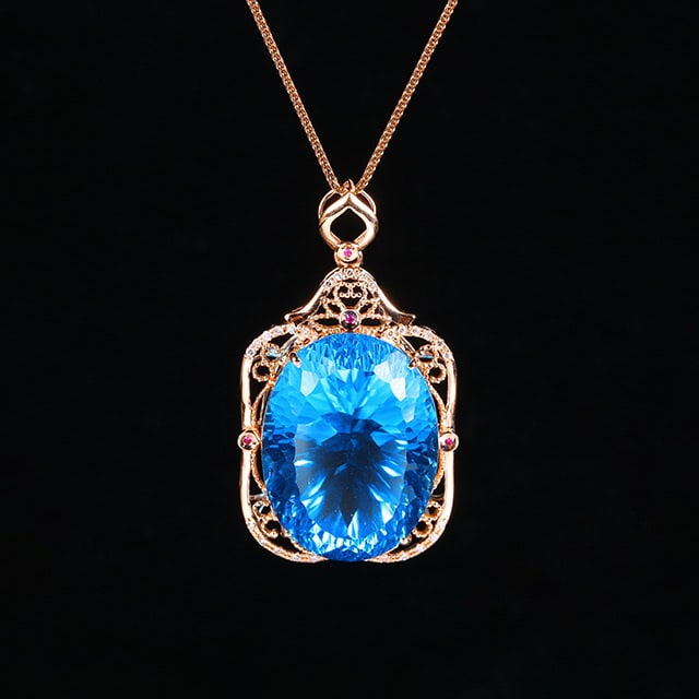 14k Gold 31.47 Ctw Natural Topaz & Diamond Pendant( Without Chain ): Ref:231048131 // gold content:14k gold // main gemstone:topaz // shape:oval // carat weight:31. 39ct // color:blue // treatment:natural // // adjacent gemstone 2 : diamond // number of stones:29 //