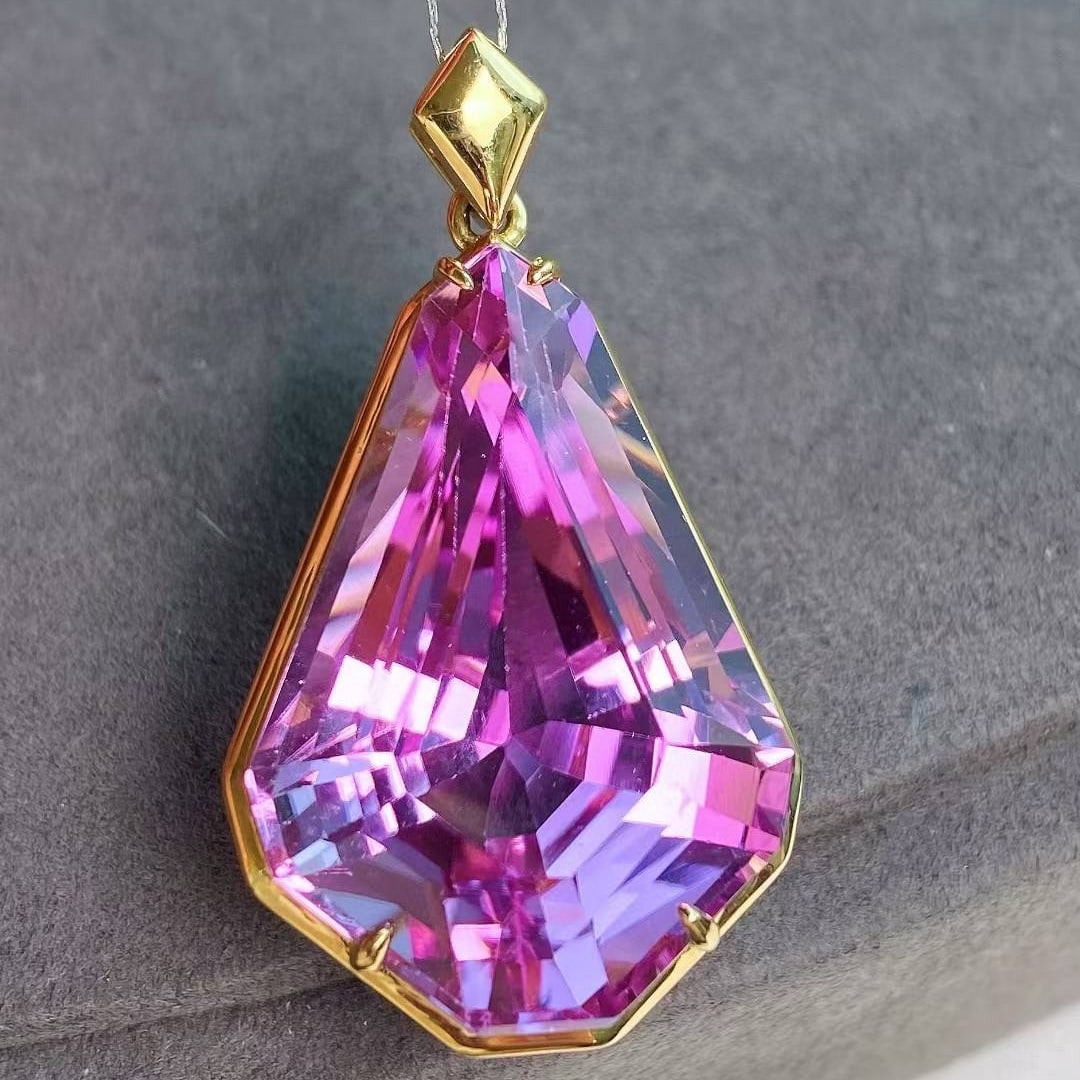 14k Gold 36.71 Ct Natural Kunzite Pendant( Without Chain ): Ref:231048284 // gold content:14k gold // main gemstone:kunzite // shape:other // carat weight:36. 71ct // color:purple // treatment:natural // Condition: New Low Estimate: 6400 High Estimate: 9600