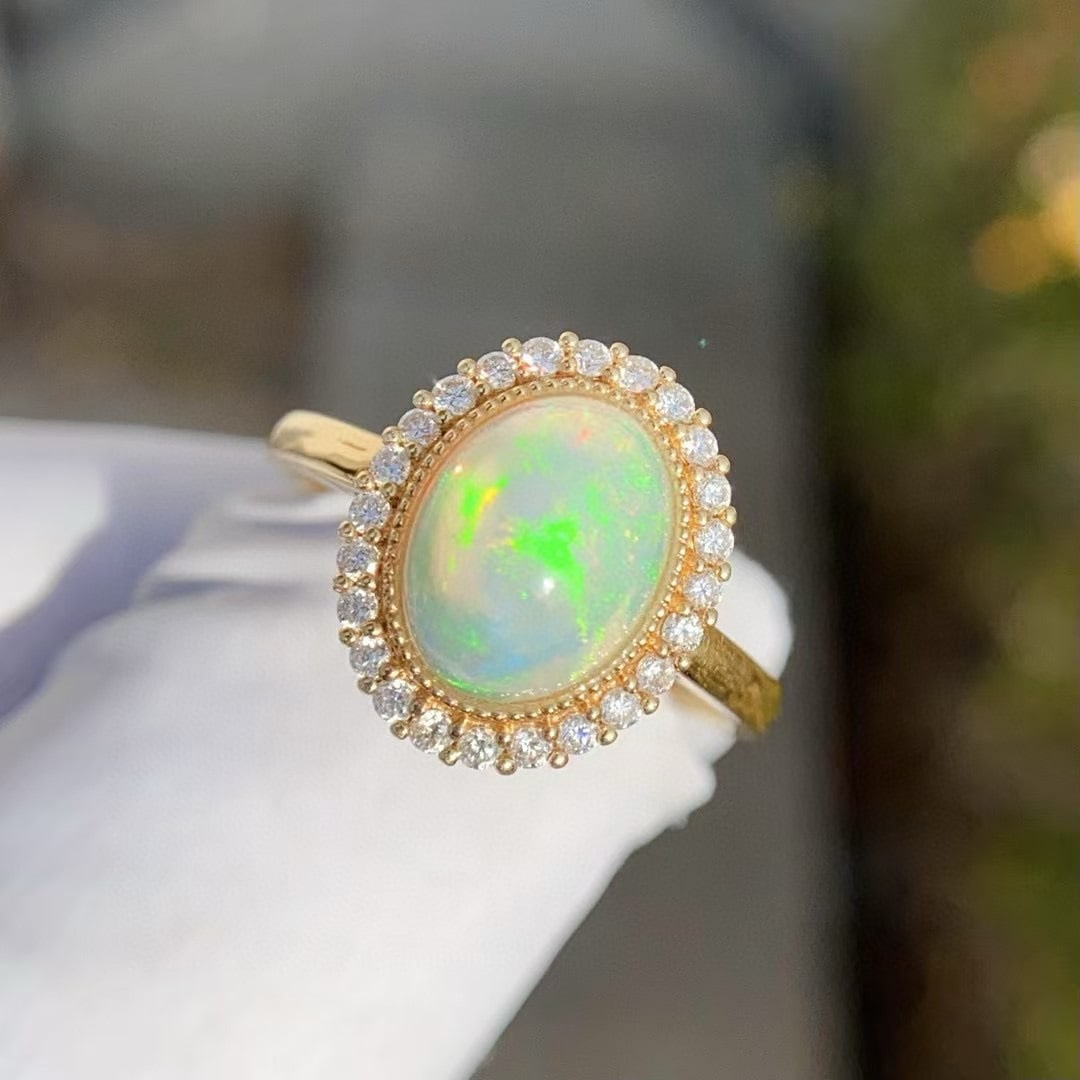 14k Gold 2 Ct Natural Opal & Diamond Ring: Ref:231048406 // gold content:14k gold // ring size:7. 25us // // main gemstone:opal // shape:oval // carat weight:2ct // color:white // treatment:natural // // adjacent gemstone 2 : diamond //