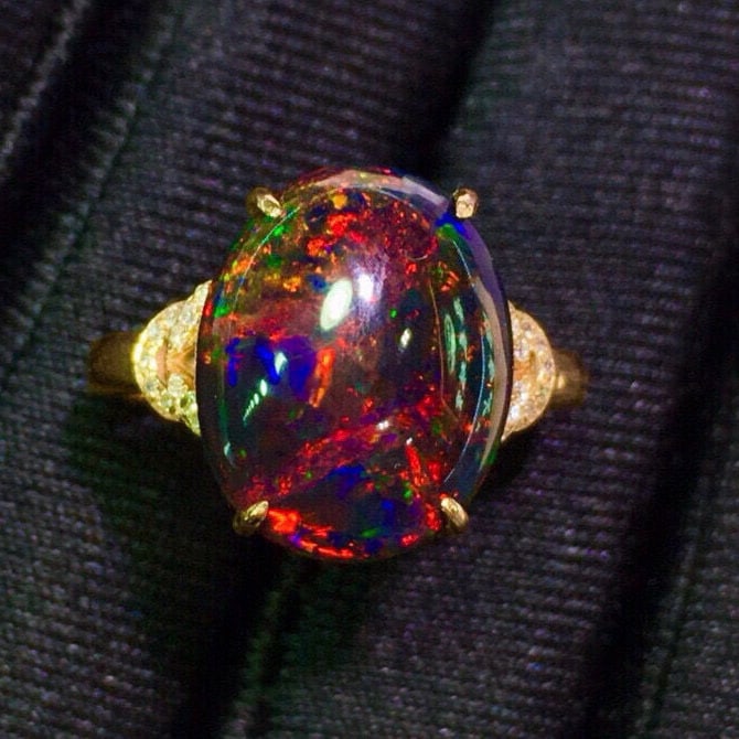 14k Gold 6.2 Ct Natural Opal & Diamond Ring: Ref:231048407 // gold content:14k gold // ring size:7. 25us // // main gemstone:opal // shape:oval // carat weight:6. 2ct // color:color // treatment:natural // // adjacent gemstone 2 : diamond // sha