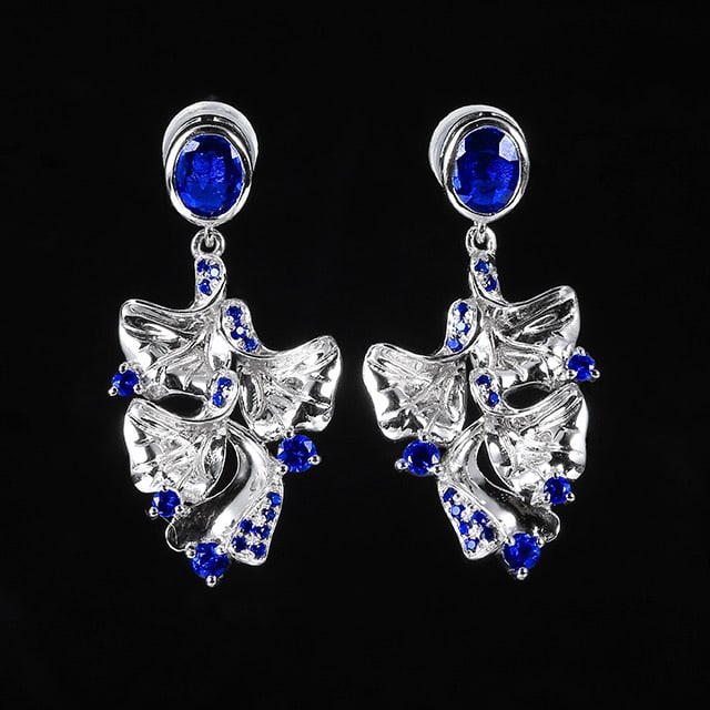 14k Gold 1.12 Ctw Natural Sapphire & Sapphire Earrings: Ref:231051024 // gold content:14k gold // main gemstone:sapphire // shape:oval // carat weight:0. 80ct // color:blue // treatment:natural // // adjacent gemstone 2 : sapphire // shape:round // carat