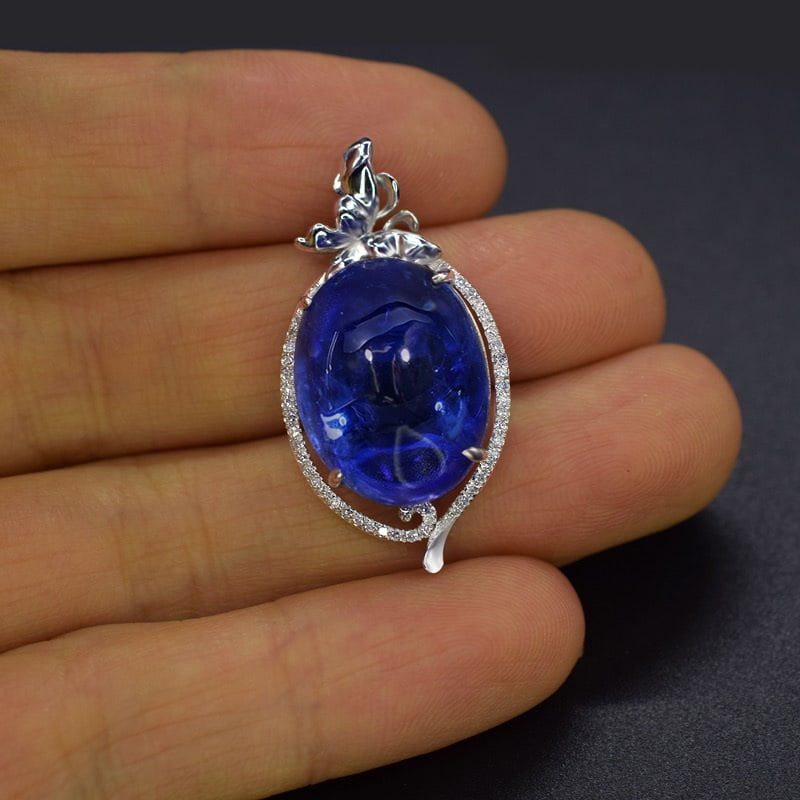 14k Gold 16.53 Ctw Natural Tanzanite & Diamond Pendant( Without Chain ): Ref:231051048 // gold content:14k gold // main gemstone:tanzanite // shape:oval // carat weight:16. 39ct // color:blue // treatment:natural // // adjacent gemstone 2 : diamond // number of stones:47