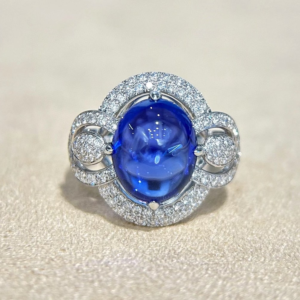 14k Gold 8.22 Ctw Natural Tanzanite & Diamond Ring: Ref:231051054 // gold content:14k gold // ring size:7. 25us // // main gemstone:tanzanite // shape:oval // carat weight:7. 43ct // color:blue // treatment:natural // // adjacent gemstone 2 : diamond