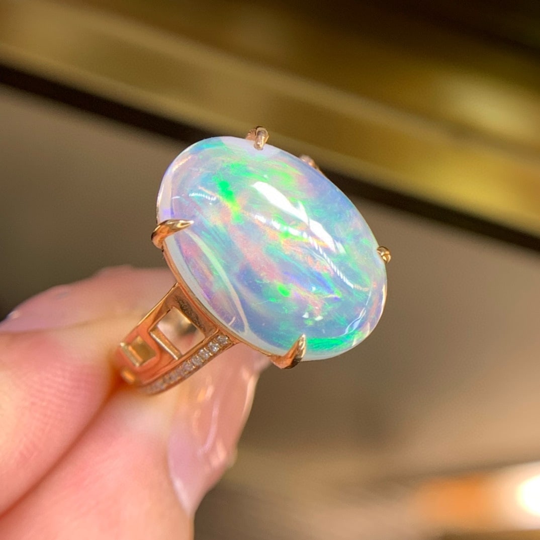 14k Gold 7.1 Ct Natural Opal & Diamond Ring: Ref:231051070 // gold content:14k gold // ring size:7. 25us // // main gemstone:opal // shape:oval // carat weight:7. 1ct // color:white // treatment:natural // // adjacent gemstone 2 : diamond // sha