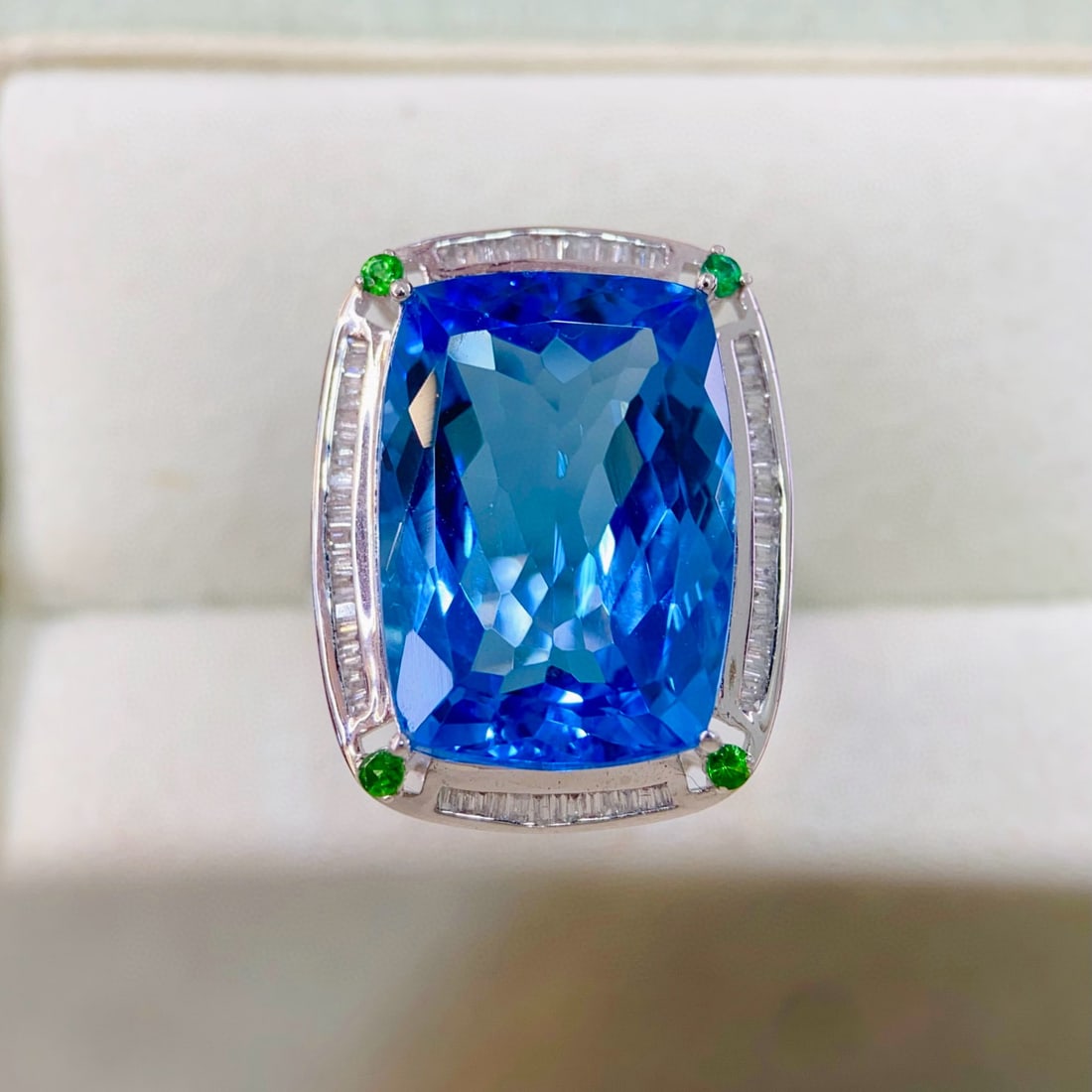 14k Gold 18.3 Ct Natural Topaz & Diamond & Tsavorite Ring: Ref:231051121 // gold content:14k gold // ring size:7. 25us // // main gemstone:topaz // shape:cushion // carat weight:18. 3ct // color:blue // treatment:natural // // adjacent gemstone 2 : diamond