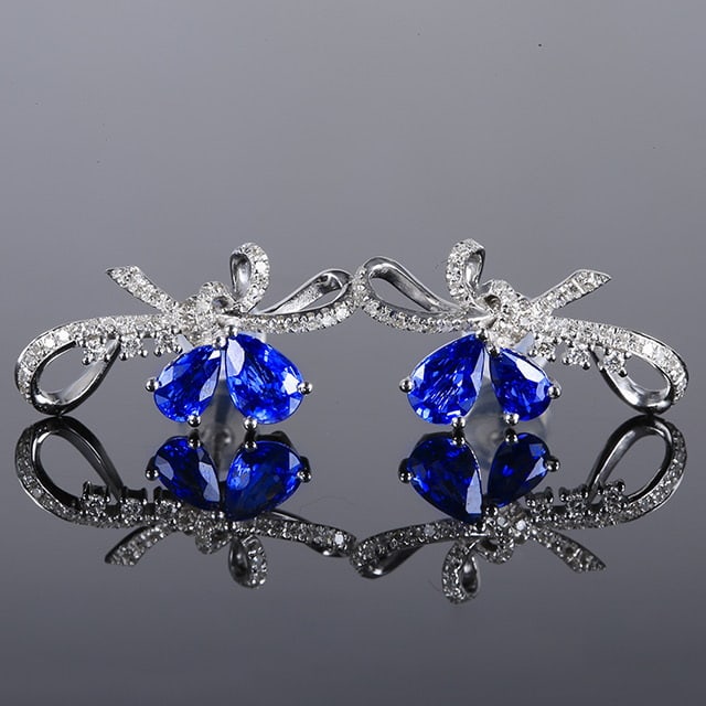 14k Gold 1.80 Ctw Natural Sapphire & Diamond Earrings: Ref:231051143 // gold content:14k gold // main gemstone:sapphire // shape:pear // carat weight:1. 5ct // color:blue // treatment:natural // // adjacent gemstone 2 : diamond // number of stones:86 //