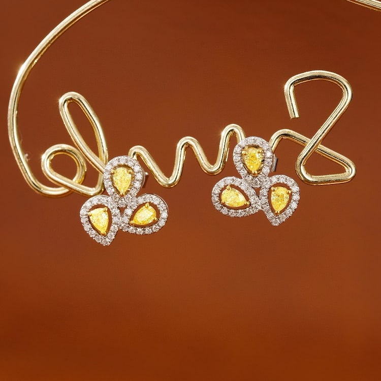 14k Gold 0.55 Ctw Natural Yellow Diamond & Diamond Earrings: Ref:231051158 // gold content:14k gold // main gemstone:yellow diamond // shape:pear // carat weight:0. 36ct // color:yellow // treatment:natural // // adjacent gemstone 2 : diamond // shape:round // 