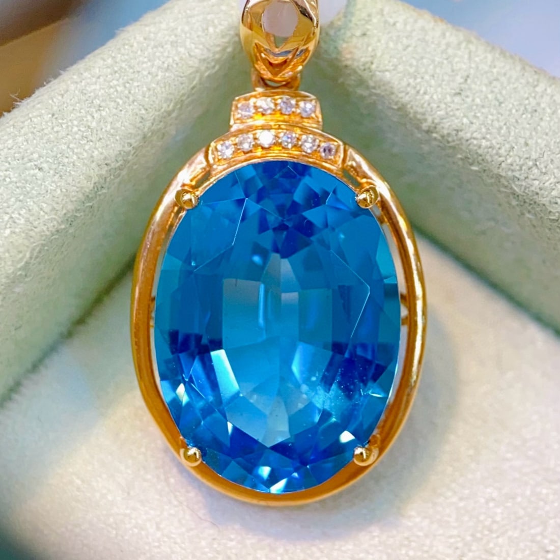 14k Gold 9.63 Ctw Natural Topaz & Diamond Pendant( Without Chain ): Ref:231051163 // gold content:14k gold // main gemstone:topaz // shape:oval // carat weight:9. 6ct // color:blue // treatment:natural // // adjacent gemstone 2 : diamond // number of stones:10 //