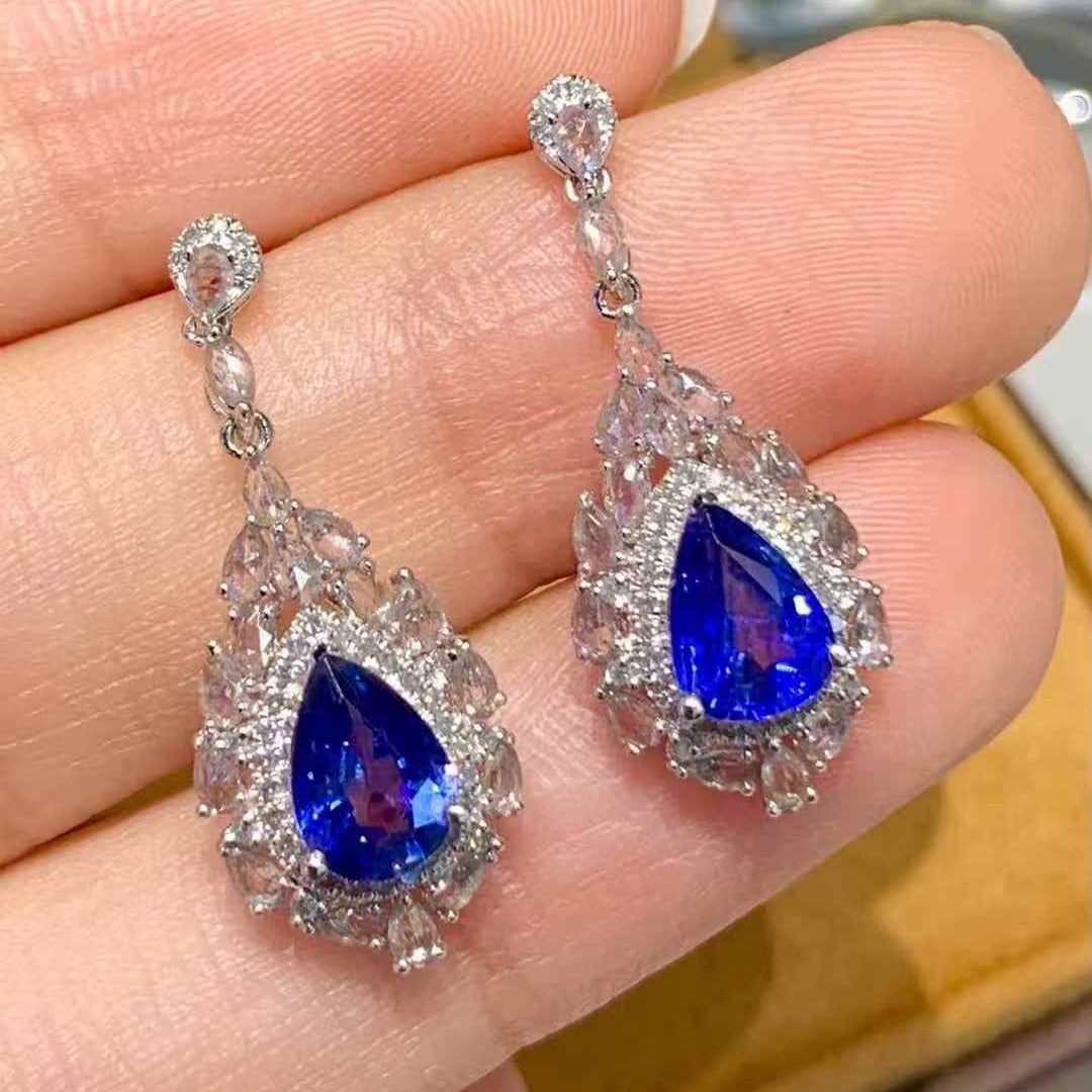 14k Gold 1.8 Ct Natural Sapphire & Diamond & Sapphire Earrings: Ref:231051179 // gold content:14k gold // main gemstone:sapphire // shape:pear // carat weight:1. 8ct // color:royal blue // treatment:natural // // adjacent gemstone 2 : diamond // shape:round //