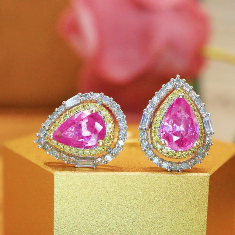 14k Gold 1.94 Ctw Natural Padparadscha Sapphire & Diamond Earrings: Ref:231051184 // gold content:14k gold // main gemstone:padparadscha sapphire // shape:pear // carat weight:1. 53ct // color:orangish pink // treatment:natural // // adjacent gemstone 2 : diamond //