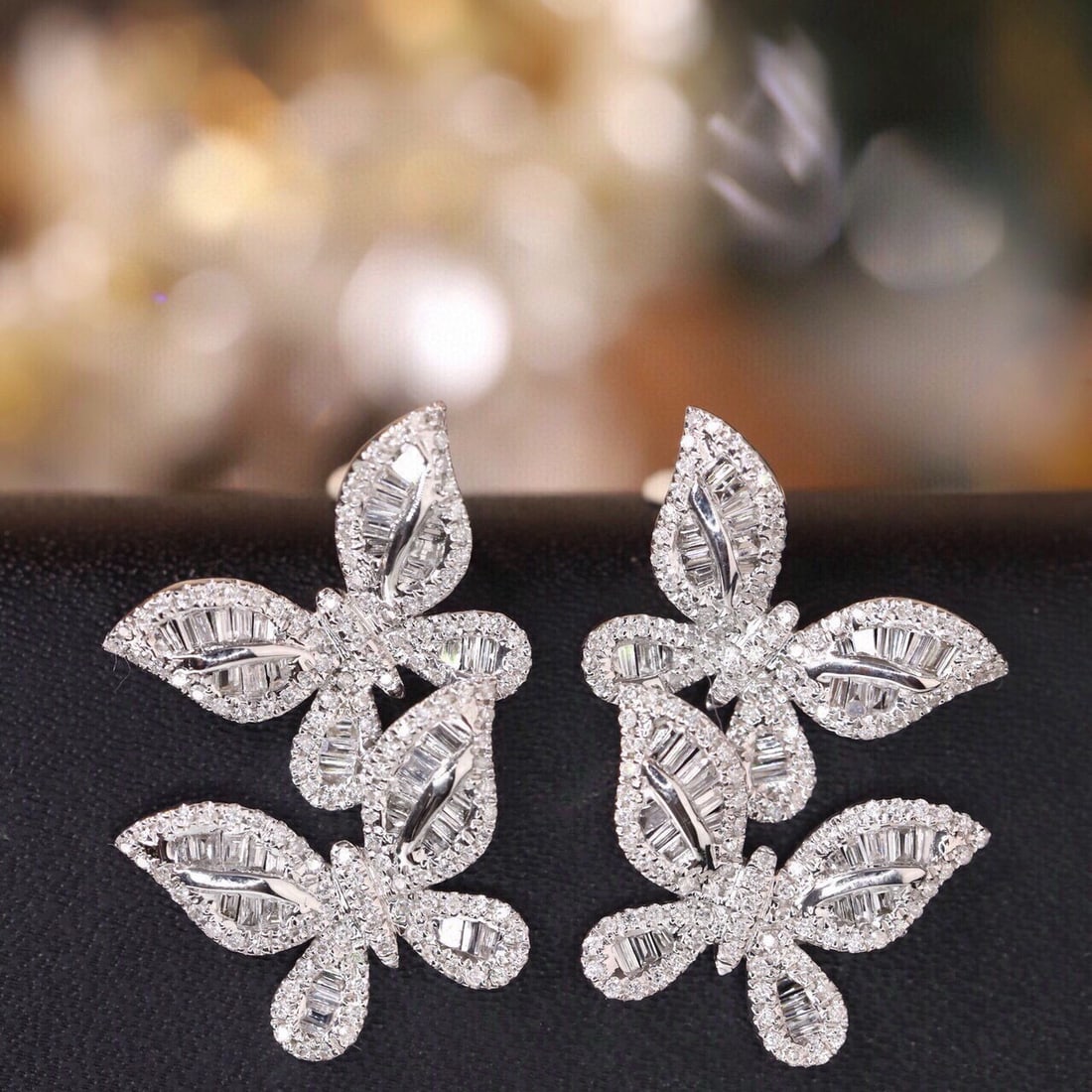 14k Gold 1.04 Ct Natural H Diamond & Butterfly Earrings: Ref:231051189 // gold content:14k gold // main gemstone:diamond // shape:multiply // carat weight:1. 04ct // clarity grade:vs-si // color:h // treatment:natural // Condition: New Low Estimate: 4600.00