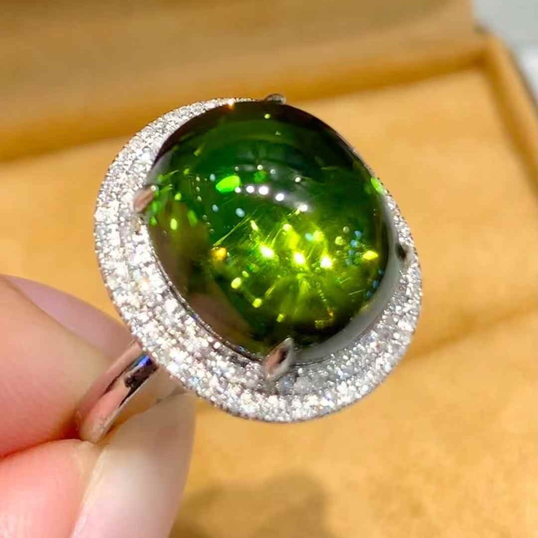 14k Gold 8.5 Ct Natural Tourmaline & Diamond Ring: Ref:231051249 // gold content:14k gold // ring size:7. 25us // // main gemstone:tourmaline // shape:oval // carat weight:8. 5ct // color:green // treatment:natural // // adjacent gemstone 2 : diamond 