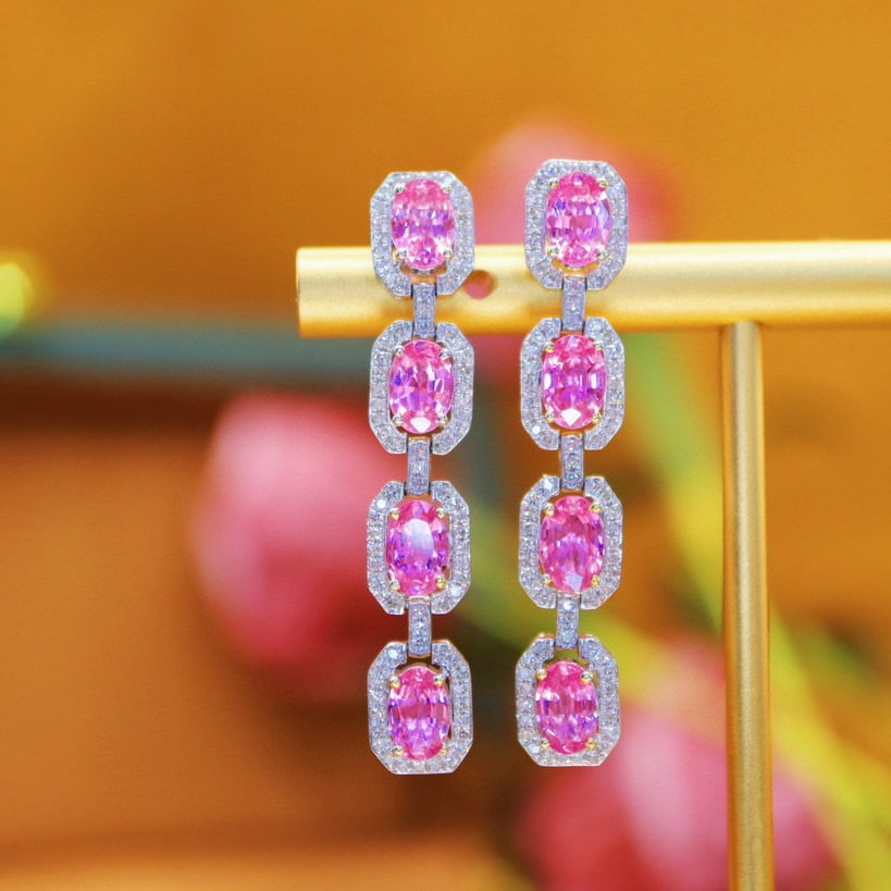 14k Gold 5.04 Ctw Natural Padparadscha Sapphire & Diamond Earrings: Ref:231052099 // gold content:14k gold // main gemstone:padparadscha sapphire // shape:oval // carat weight:4. 55ct // color:orangish pink // treatment:natural // // adjacent gemstone 2 : diamond // n