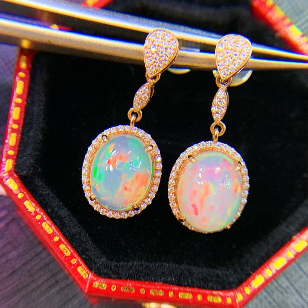 14k Gold 2.3 Ct Natural Opal & Diamond Earrings: Ref:231052102 // gold content:14k gold // main gemstone:opal // shape:oval // carat weight:2. 3ct // color:color // treatment:natural // // adjacent gemstone 2 : diamond // number of stones:92 //