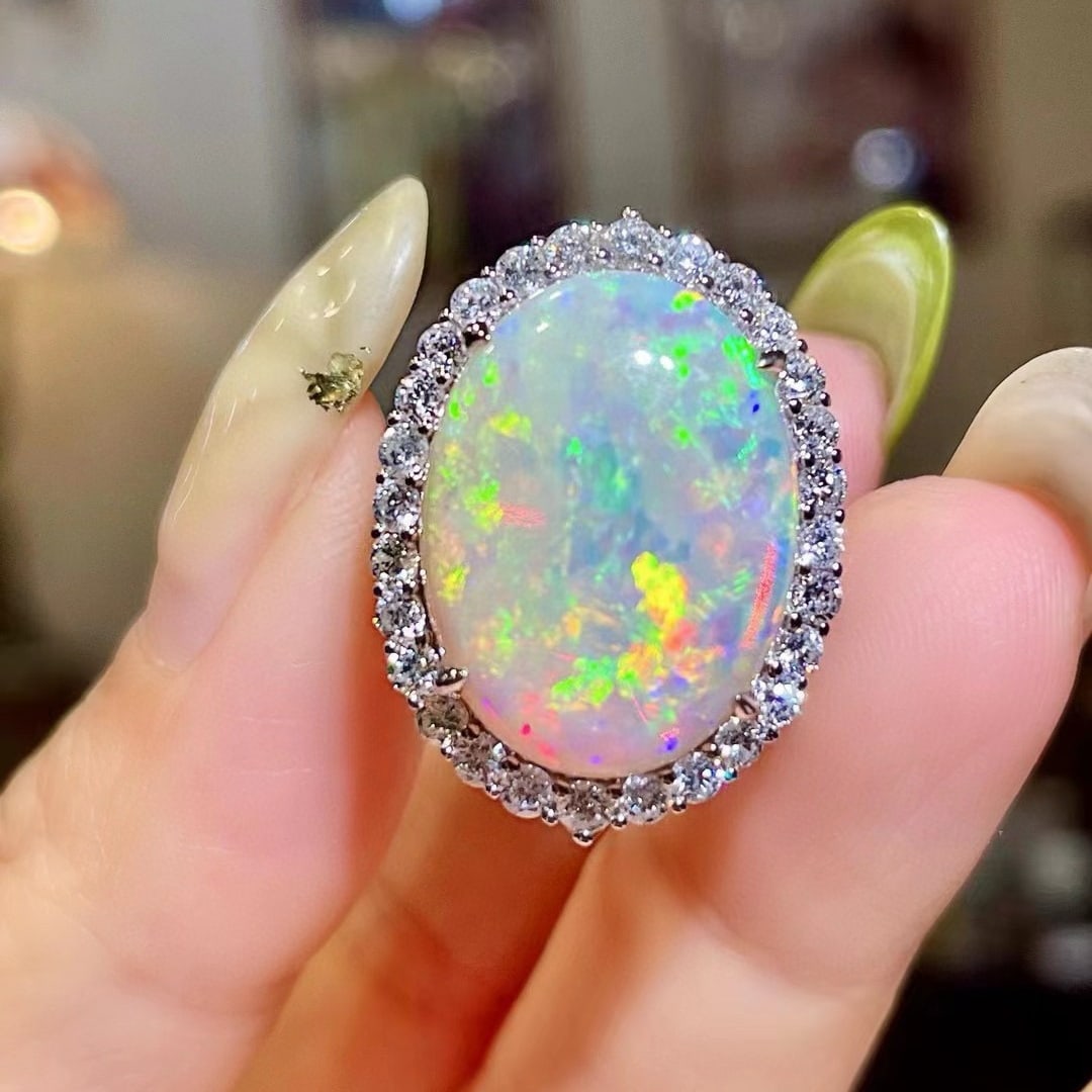 14k Gold 10.60 Ctw Natural Opal & Diamond Ring: Ref:231052129 // gold content:14k gold // ring size:7. 25us // // main gemstone:opal // shape:oval // carat weight:9. 14ct // color:color // treatment:natural // // adjacent gemstone 2 : diamond // sh