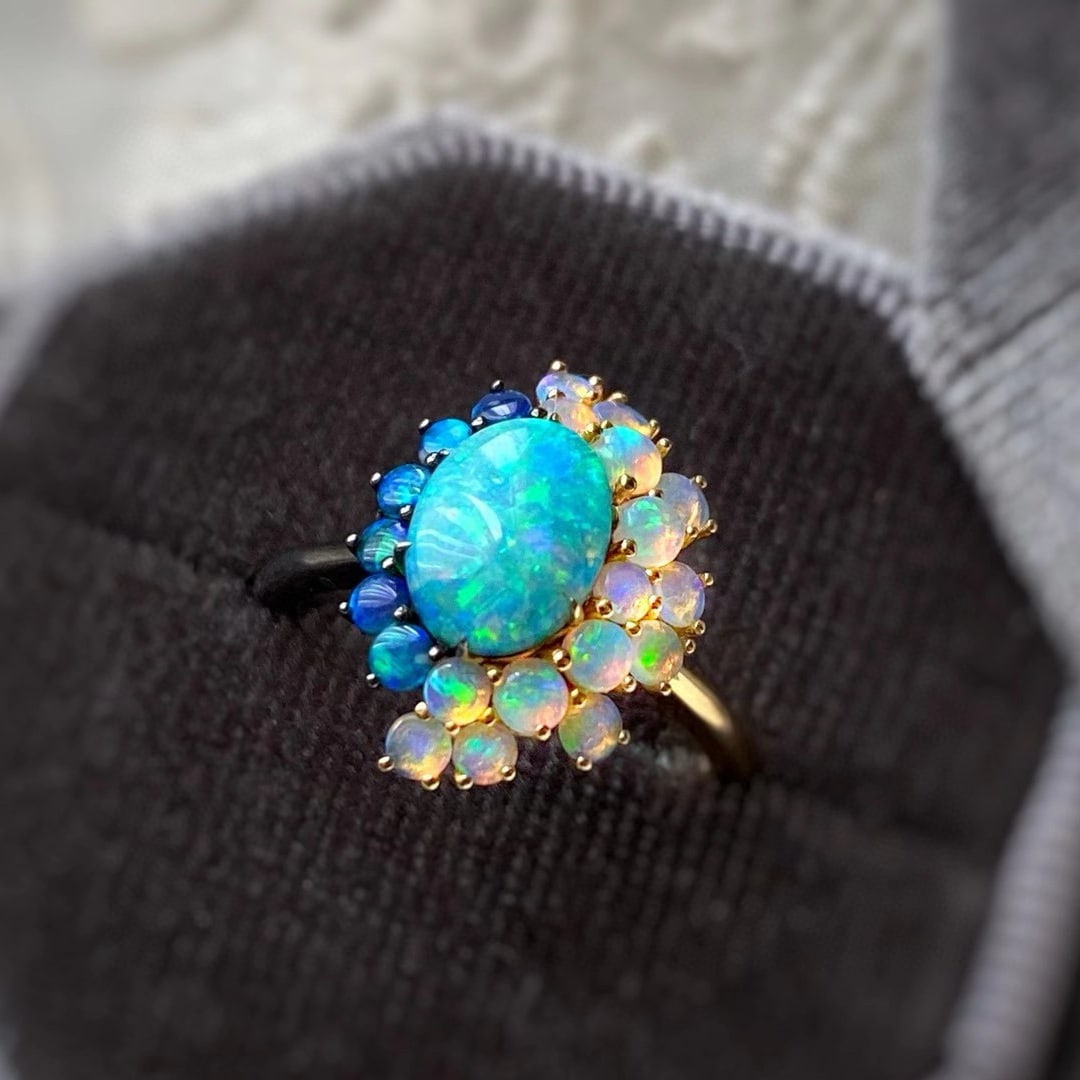 14k Gold 0.7 Ct Natural Opal & Opal Ring: Ref:231052175 // gold content:14k gold // ring size:7. 25us // // main gemstone:opal // shape:oval // carat weight:0. 7ct // color:color // treatment:natural // // adjacent gemstone 2 : opal //