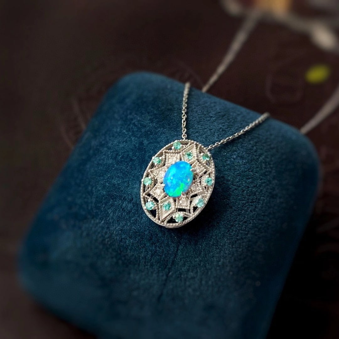 14k Gold 0.63 Ctw Natural Opal & Paraiba Tourmaline Pendant( Without Chain ): Ref:231052178 // gold content:14k gold // main gemstone:opal // shape:oval // carat weight:0. 5ct // color:color // treatment:natural // // adjacent gemstone 2 : paraiba tourmaline // shape:round // c