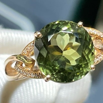 14k Gold 5.65 Ct Natural Tourmaline & Diamond Ring: Ref:231052226 // gold content:14k gold // ring size:7. 25us // // main gemstone:tourmaline // shape:oval // carat weight:5. 65ct // color:green // treatment:natural // // adjacent gemstone 2 : diamond