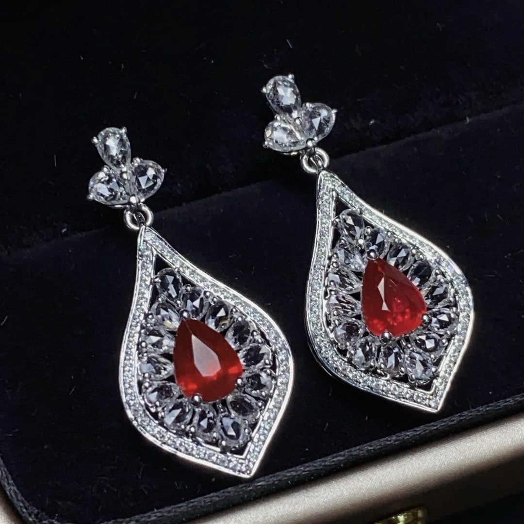 14k Gold 2.0 Ctw Natural Ruby & Diamond Earrings: Ref:231052244 // gold content:14k gold // main gemstone:ruby // shape:pear // carat weight:1. 7ct // color:red // treatment:natural // // adjacent gemstone 2 : diamond // shape:round // carat weight:0