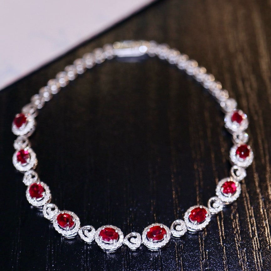 14k Gold 2.3 Ct Vivid Red Natural Ruby & Diamond Bracelet: Ref:231052250 // gold content:14k gold // main gemstone:ruby // shape:oval // carat weight:2. 3ct // color:vivid red // treatment:natural // // adjacent gemstone 2 : diamond // number of stones:257 //