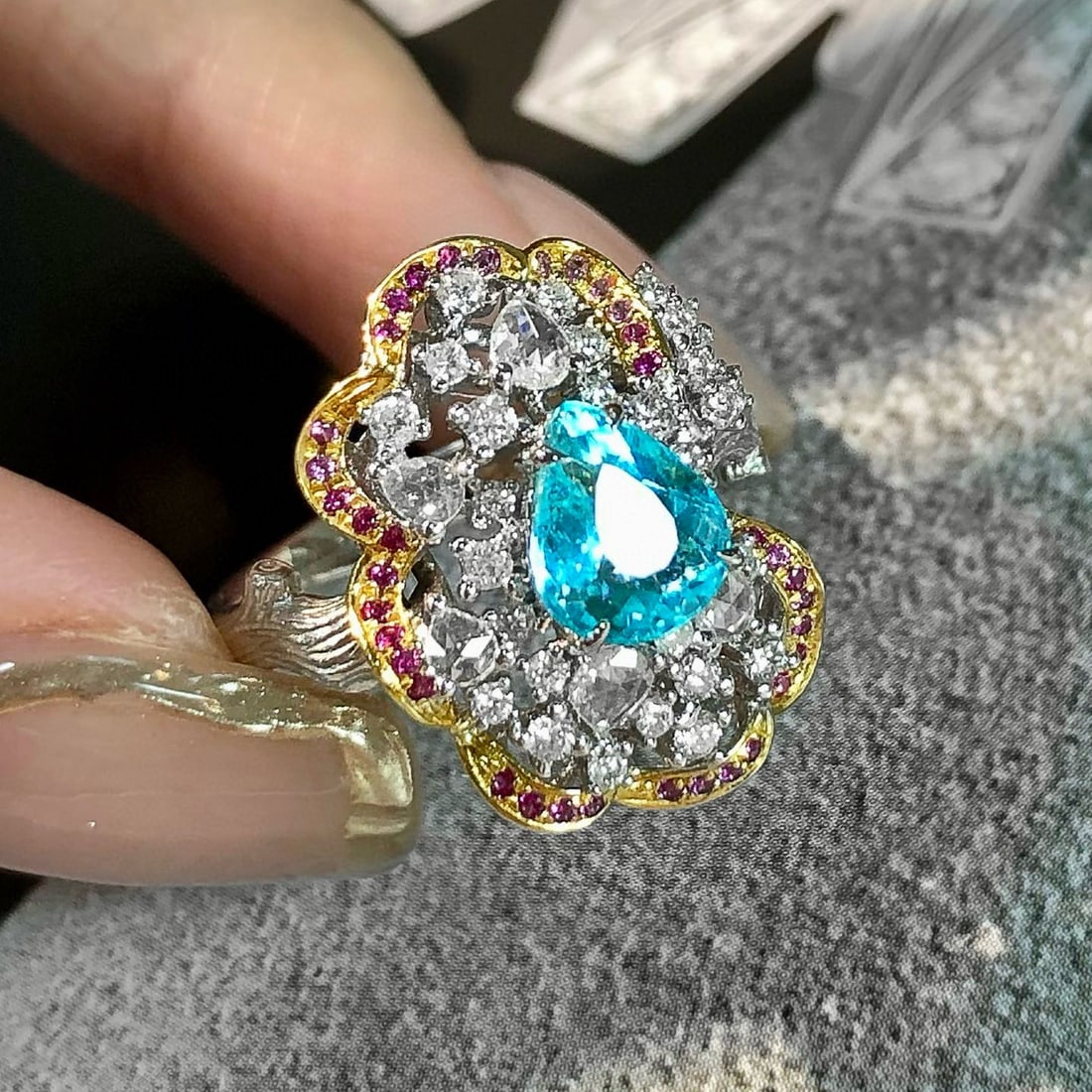 14k Gold 1.58 Ctw Natural Paraiba Tourmaline & Diamond Ring: Ref:231052267 // gold content:14k gold // ring size:7. 25us // // main gemstone:paraiba tourmaline // shape:pear // carat weight:1. 08ct // color:blue // treatment:natural // // adjacent gemstone 2 :
