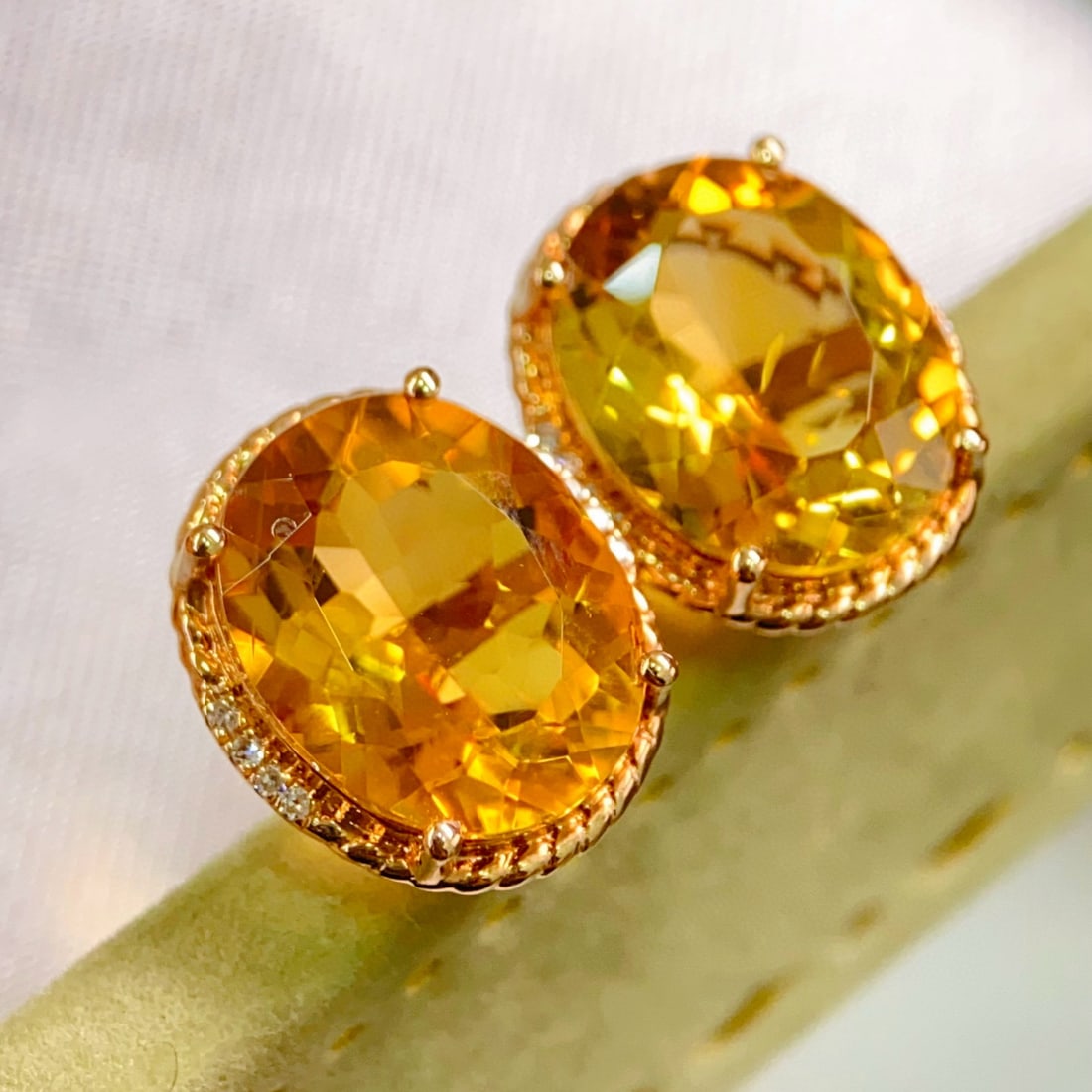 14k Gold 6.25 Ctw Natural Citrine & Diamond Earrings: Ref:231052365 // gold content:14k gold // main gemstone:citrine // shape:oval // carat weight:6. 2ct // color:yellow // treatment:natural // // adjacent gemstone 2 : diamond // number of stones:16 //