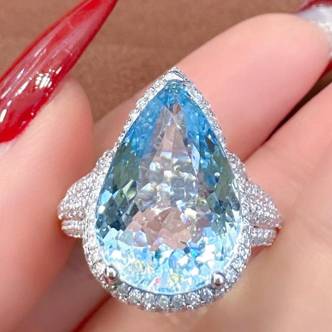 14k Gold 8.40 Ctw Natural Aquamarine & Diamond Ring: Ref:231052371 // gold content:14k gold // ring size:7. 25us // // main gemstone:aquamarine // shape:pear // carat weight:7. 58ct // color:blue // treatment:natural // // adjacent gemstone 2 : diamond